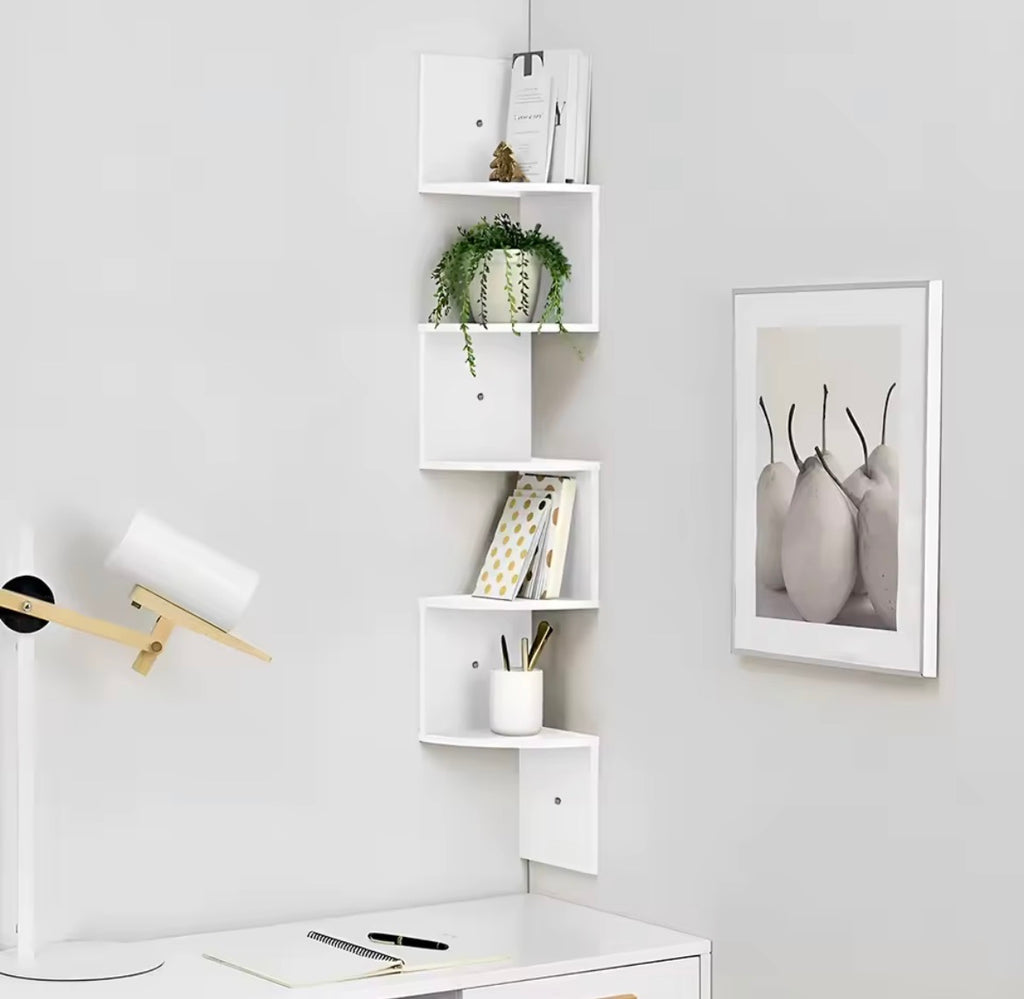 White floating corner shelf used above a home office desk
