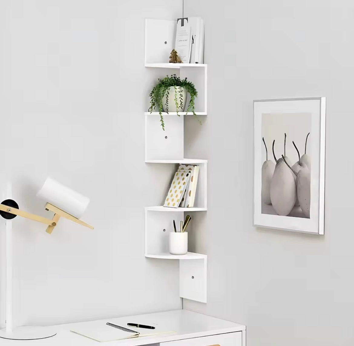 White floating corner shelf used above a home office desk