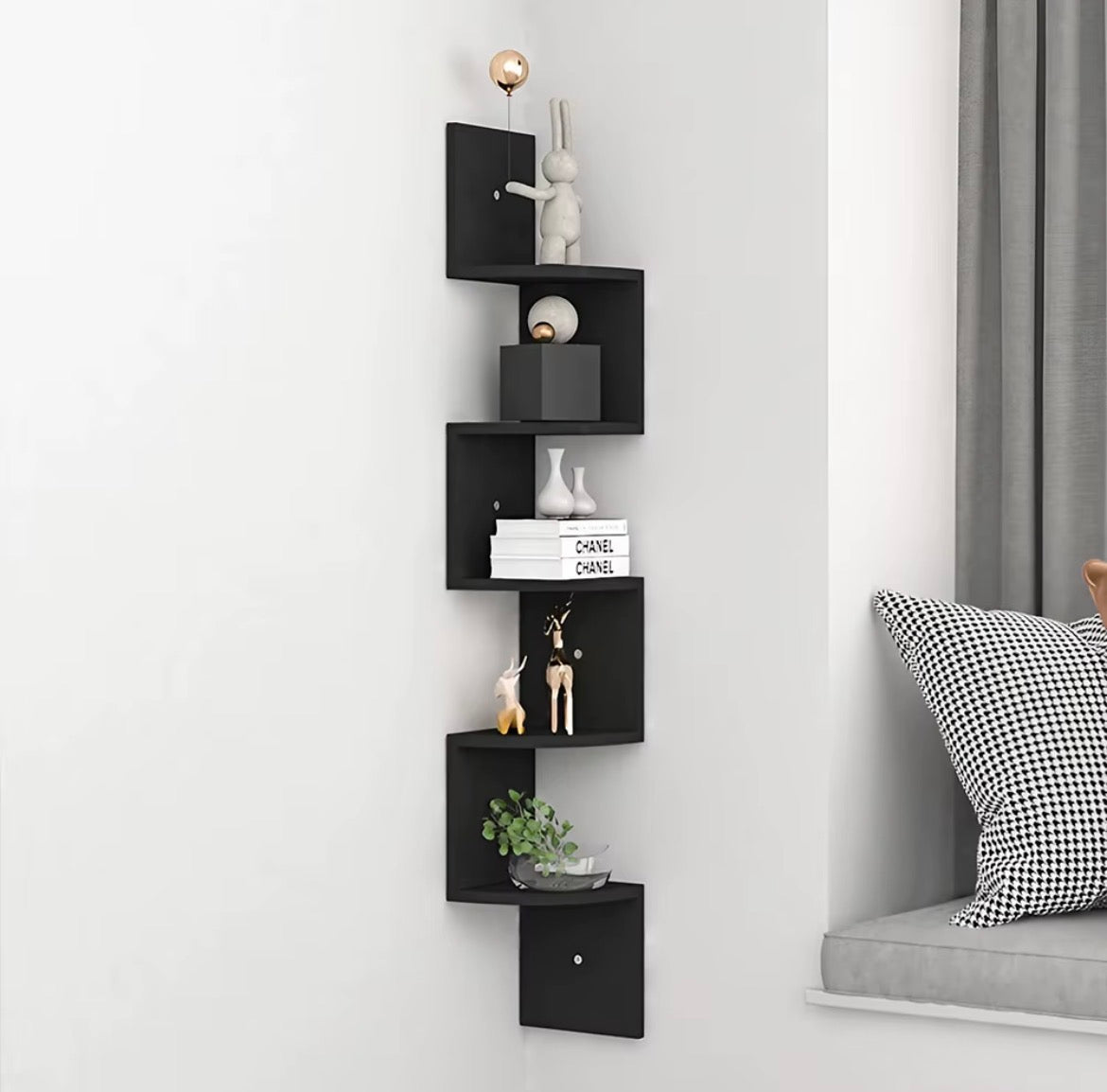 Black wall-mounted corner shelf with five curved display tiers