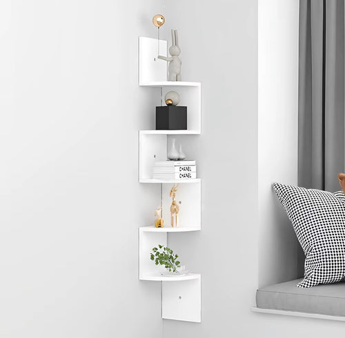 White zigzag corner shelf mounted beside a window seat