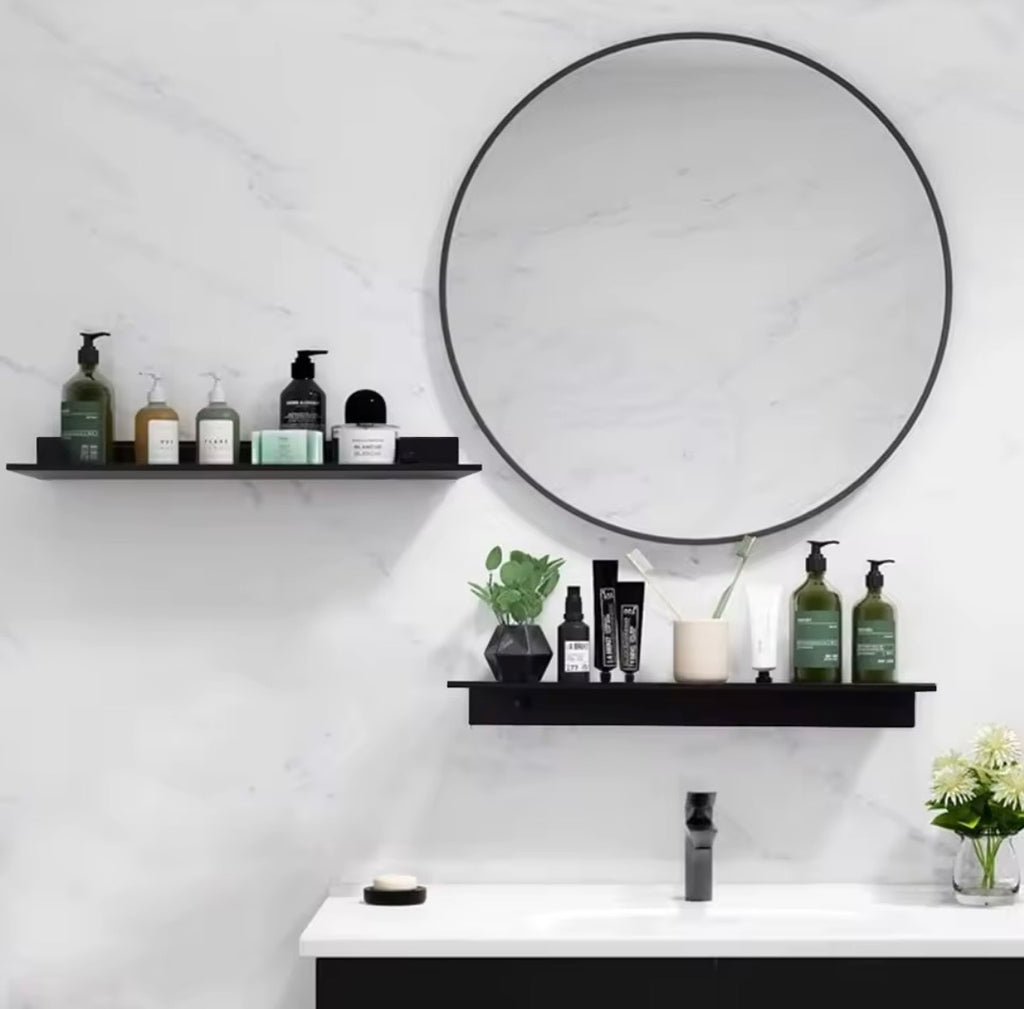 Black metal picture ledge shelf used in bathroom above basin
