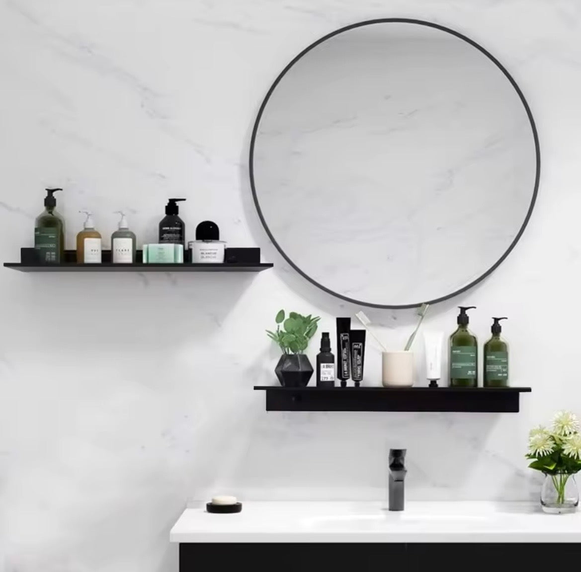 Black metal picture ledge shelf used in bathroom above basin