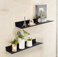 Black metal picture ledge wall shelf used for decor