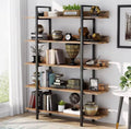 Brown and black five-tier industrial bookcase styled with books, plants and decorative objects