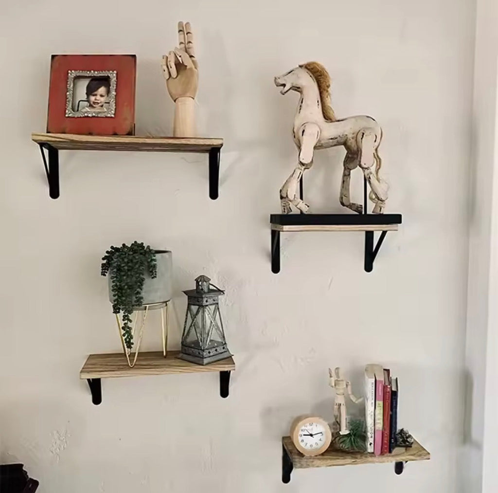 Wooden wall shelves displayed with decor and books