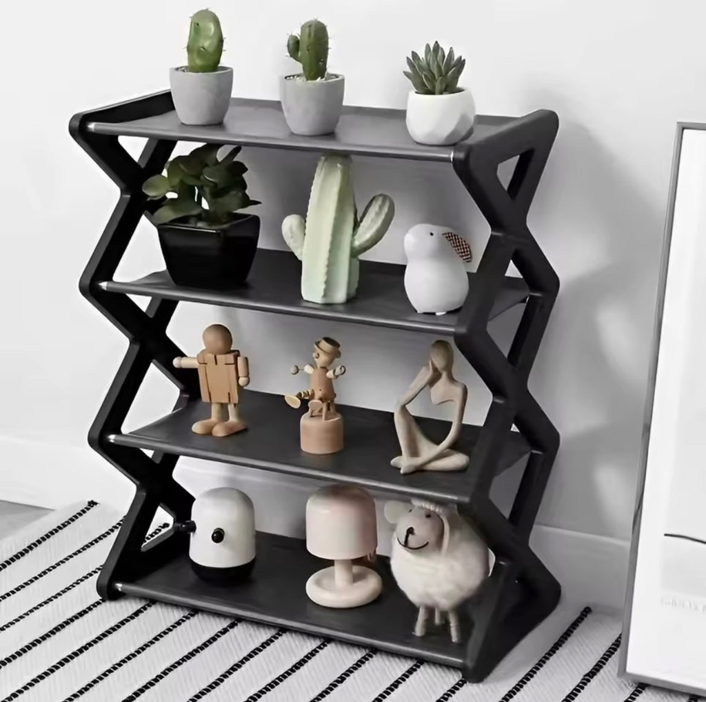 Black 4 tier X type storage rack used as display shelf