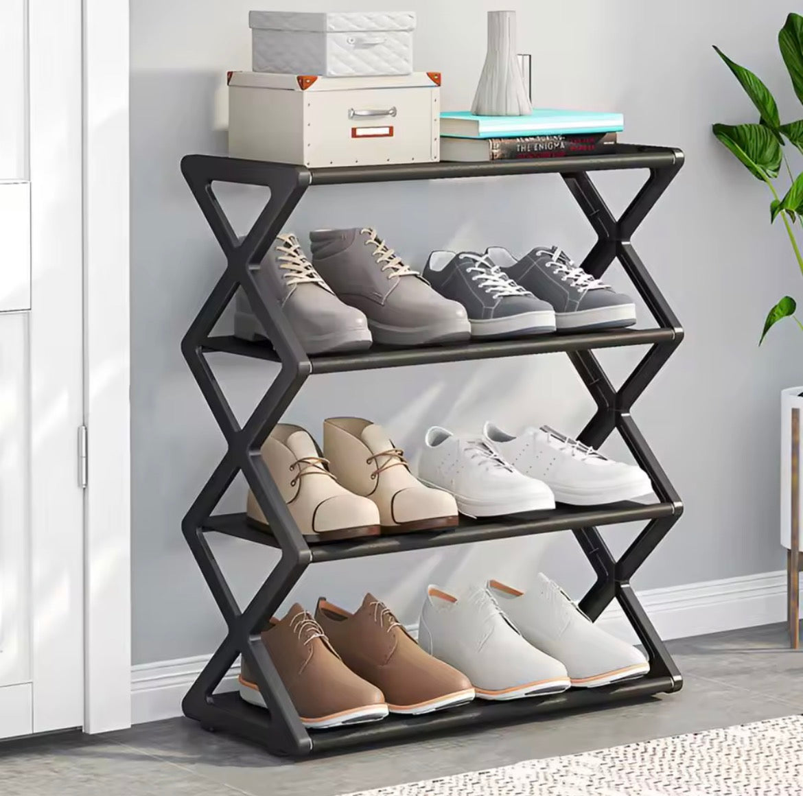 Black 4 tier X type shoe storage rack in hallway